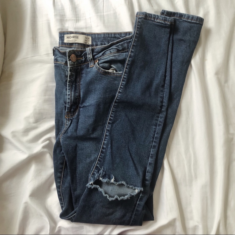 High rise busted knee skinny jeans